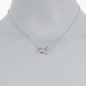 Adorina NWOT white rhodium plated, interlocking ring, necklace